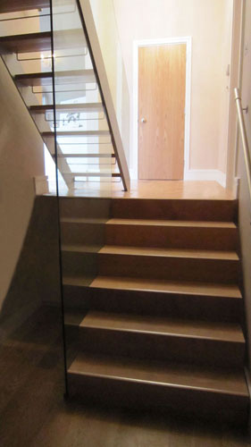 Powder Coated Aluminium and Steel, European Oak Treads with 12mmm Toughened Glass Balustrades
