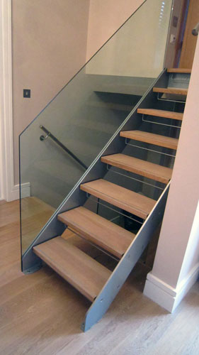 Powder Coated Aluminium and Steel, European Oak Treads with 12mmm Toughened Glass Balustrades